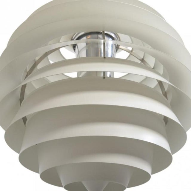 Poul Henningsen Louvre lamp with white metal shades. The lamp is from the 1980s and appears with some dents in the shades...
