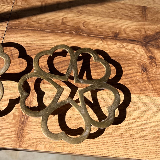 Up for consideration is a beautiful vintage pair of brass four leaf clover trivets. These would look lovely in your home...