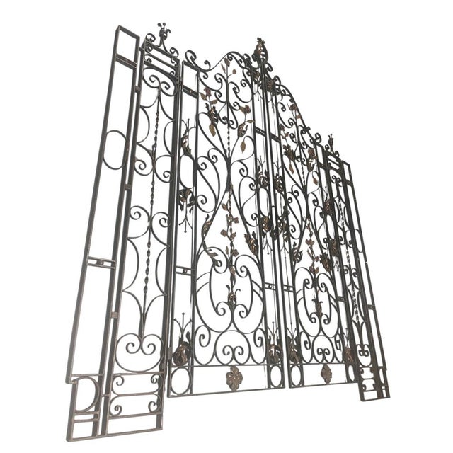 An exceptional and grand four-piece set of vintage cast iron estate gates, beautifully evoking classic French provincial...
