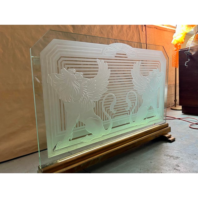 Art deco etched glass fireplace screen. Designed with two regal looking griffins (lions with wings, a mythological...