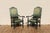 Wonderful pair of early 20th century antique high-back throne armchairs featuring beautifully carved dark solid wood...