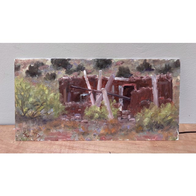 This oil painting captures the weathered remnants of an adobe ruin in New Mexico, evoking a sense of nostalgia and the...