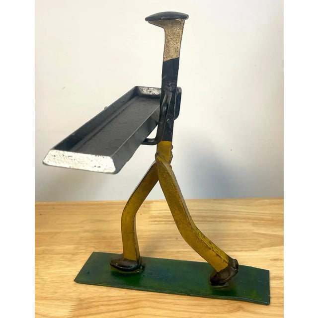 Folk Art polychromed iron construction worker card holder/ vide-poche A whimsical well executed Folk Art sculpture of...