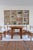 A round dining table in solid elm, attributed to Maison Regain and made in France in the 1980s. The top is built from...