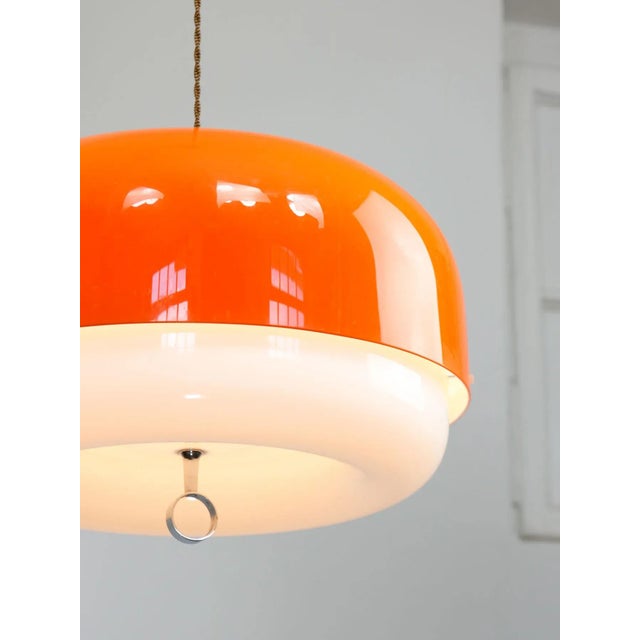 This is a very rare 45cm diameter guzzini lamp in orange colour (35cm diameter is standard, see photos with the chair and...