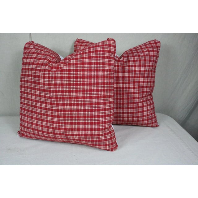 A pair of throw pillows made from 19th century French antiques materials. The red check top is made of linen homespun...