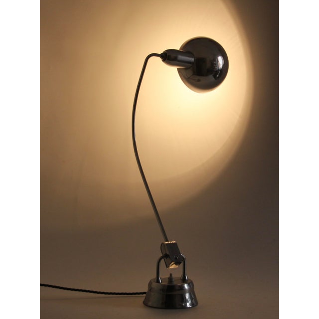 This vintage desk lamp was designed by Charlotte Perriand between 1920 and 1949 in France. It is larger as the usual...