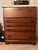 Add sophisticated storage density and timeless warmth to your space with this handsome vintage 1960s–1970s Traditional...
