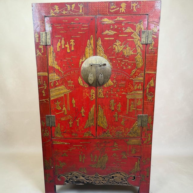 A beautiful pair of handmade red lacquer chinoiserie 2 door armoire’s. Each with 2 doors and great brass moon face applied...