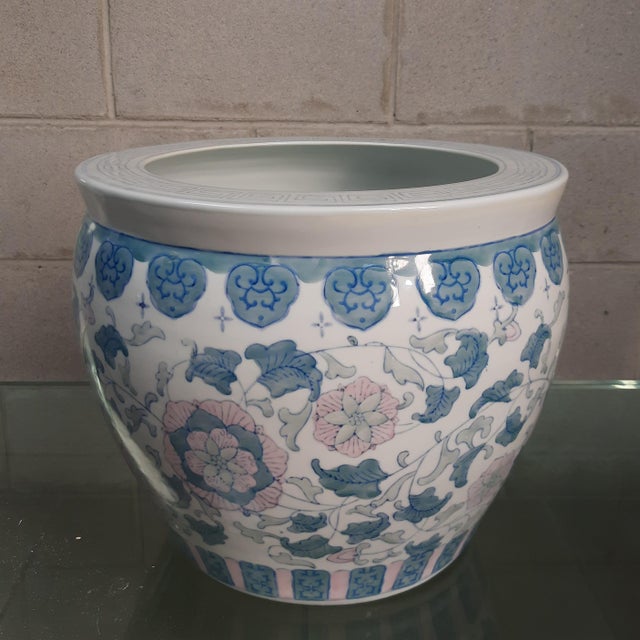 Refined, classically styled vase in glazed ceramic, a Fishbowl (or Cachepot) model, characterized by a soft, luminous...