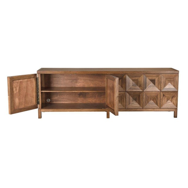 This extra-large four-door sideboard features a geometric face in a warm Dark Walnut finish. Its elongated profile, clean...