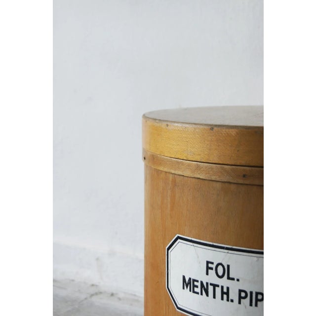 A classic apothecary container. the label is marked in black text fol .menth. Pip . the container would have originally...