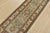 A traditional Caucasian Kazak runner hand-knotted with fine wool on a cotton foundation. This rug features botanical...