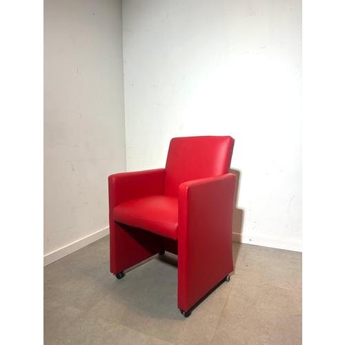 A vibrant set of red skai leather armchairs, crafted in the 1980s with a clean, modern silhouette and smooth lines. Each...