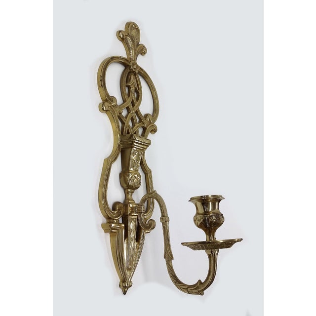 A beautiful work of art for your wall. This intricately designed sculpted brass wall sconce can be a huge statement piece!...