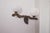 Vintage driftwood wall lamp crafted from a genuine vine root (“cep de vigne”), featuring two white milky glass globes that...