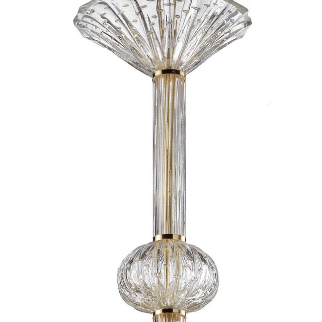 Scenographic venetian chandelier in transparent Murano glass full of gold leaf. 15 lights for an imperial chandelier in...