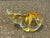 The sculpture is crafted using solid, heavy leaded glass with an internal sommerso amber and gold gradient color that...