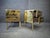 Pair of brass nightstands with a black opaline top and two drawers. The sides and front are decorated with circular...