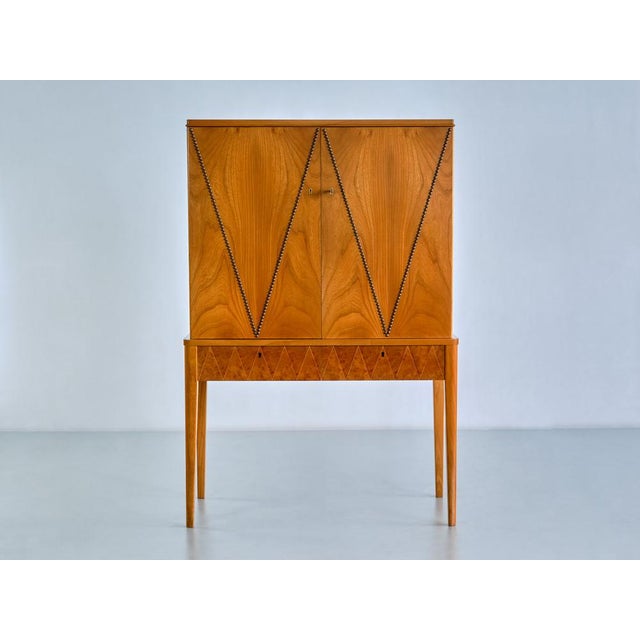 This very rare cabinet was produced by ab svenska möbelfabrikerna in bodafors, sweden in the late 1940s. The striking...