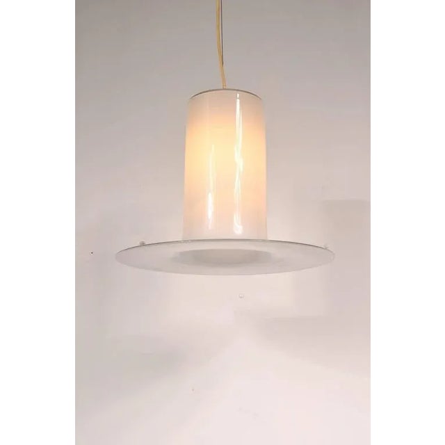 A Murano glass ceiling lamp by Alessandro Pianon, manufactured by Vistosi in Italy around 1960. This lamp is made from...