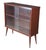 Mid century book case / curio cabinet with sliding glass doors, two shelves, and tapered legs. Dimensions: 35" x 35" x 11.5"