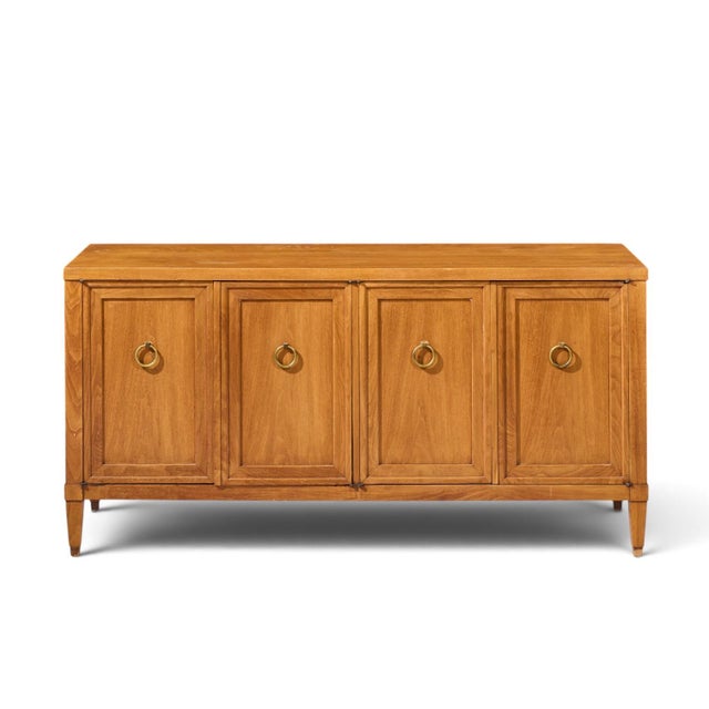 Baker Milling Road Walnut and Brass Credenza This credenza measures: 60 wide x 20.5 deep x 30 inches high ABOUT PHOTOS: We...