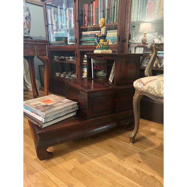 This is a late 1940s step chest or commode or library stairs executed in richly toned mahogany with dramatic Ming-style...