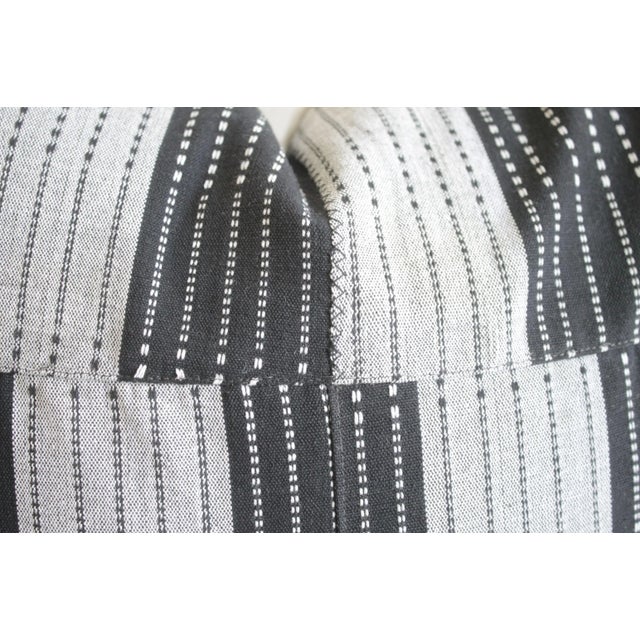 Vintage black and natural color block pillows This cotton face features a black and grayish-natural linen colored...