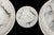 A refined round ceiling light fixture with a 12 inch featuring a soft white glass surface with natural gray veining and an...
