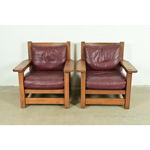 An exceptional pair of Mission or Arts & Crafts style Eastwood lounge chairs By L. & J.G. Stickley USA, 1999 Solid quarter...