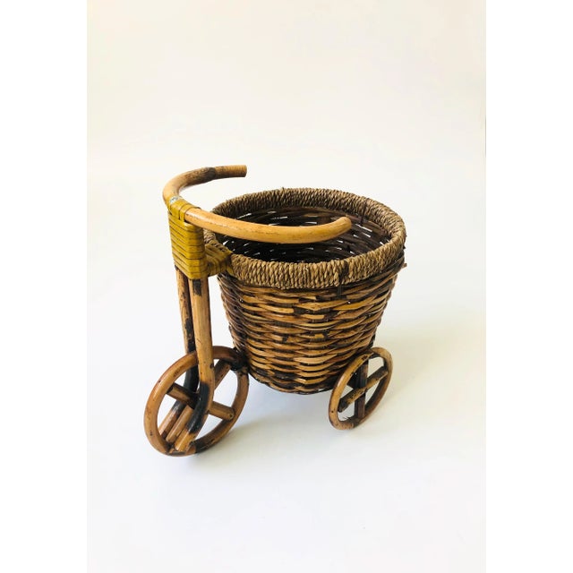 An adorable vintage plant basket bicycle. Sweet rattan detailing to the wheels a nice built in basket perfect for keeping...