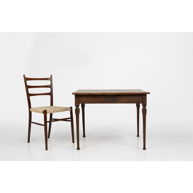 A charming mid‑19th‑century French side table crafted from solid oak, showcasing the rustic elegance typical of provincial...