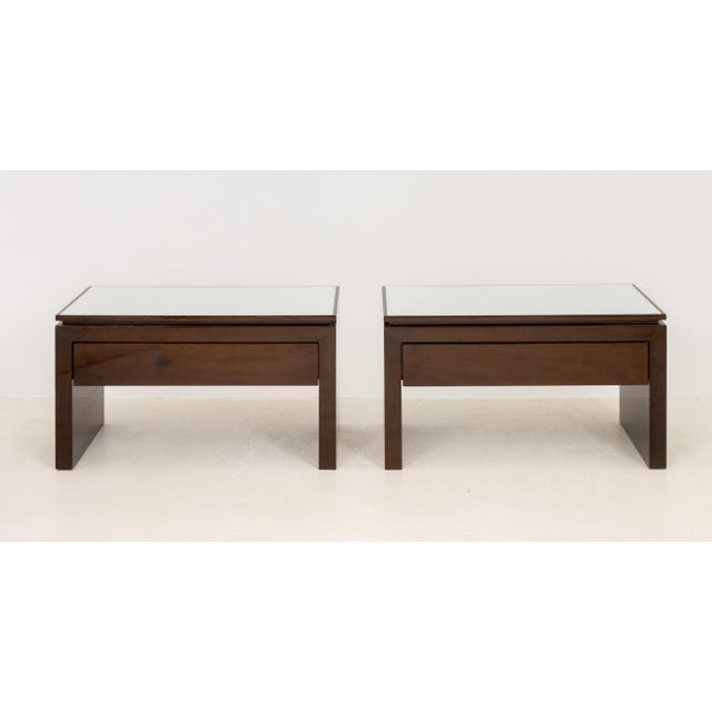 Pair of Modern White Glass and Mahogany Side Tables, each with single drawer. 20" H x 36.5" W x 20.25" D. Provenance: From...