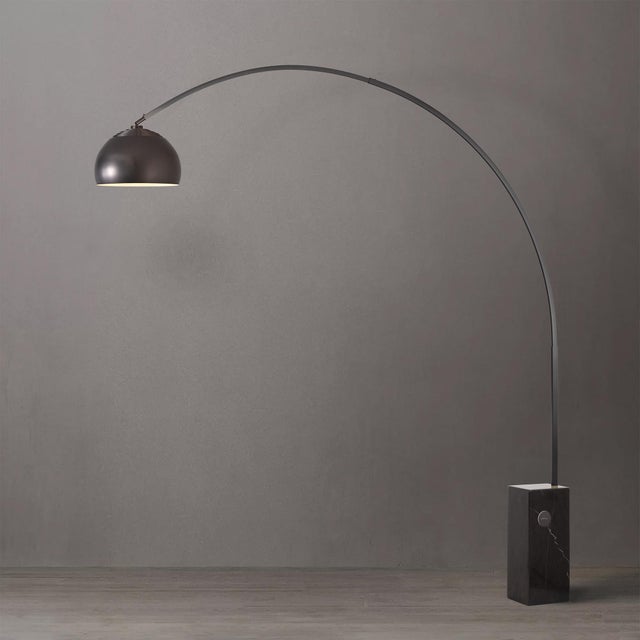 Crafted with a Black Nickel steel body and a Black Marble base, the Iconic Arc Lamp is a Mid-Century Modern masterpiece....