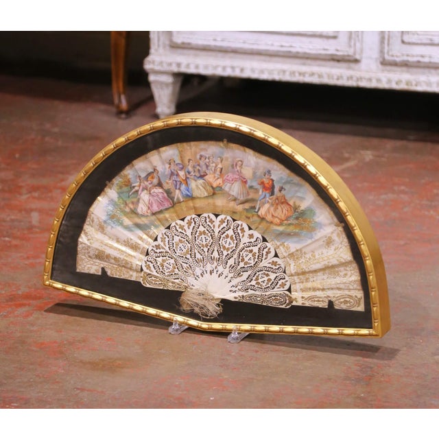 Decorate a wall or salon with this elegant antique framed fan, crafted in France circa 1870. Presented within a half-moon...