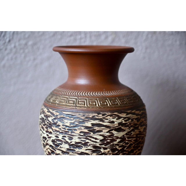 This large, scarified vase with an ethnic and brutalist style was produced by SP Hillscheid in Germany. It is an...