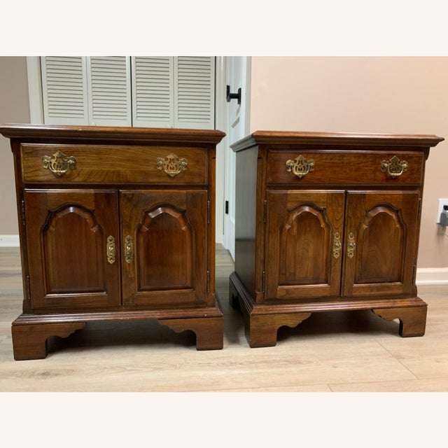 Pair of Ethan Allen Georgian Court collection Chippendale solid cherry nightstand having a beveled top and one dovetailed...