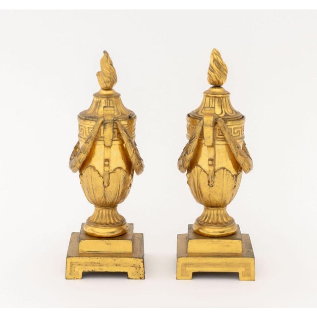 Pair of French Empire Gilt Bronze Urn Form Candlestick-Cassolettes, the covered torch form lids with convertible bobeches,...