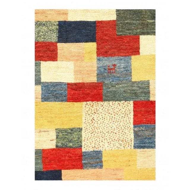 Gabbeh rugs are made by the nomadic Qashqai tribes of southern Iran. They are rough cut and long piled rugs of rich color...