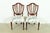 A gorgeous pair of Federal or Hepplewhite style shield back side chairs or dining chairs By Baker Furniture, "Historic...