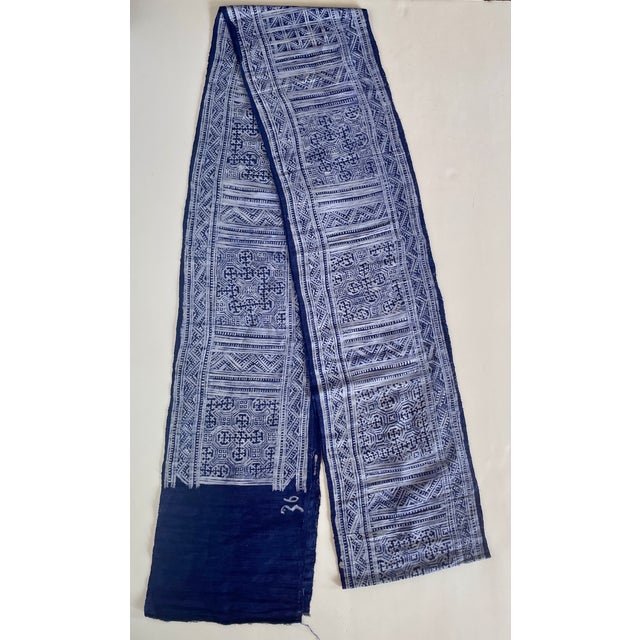 Beautiful length of hand-loomed and handprinted indigo and off-white fabric in a geometric pattern that could be used as a...