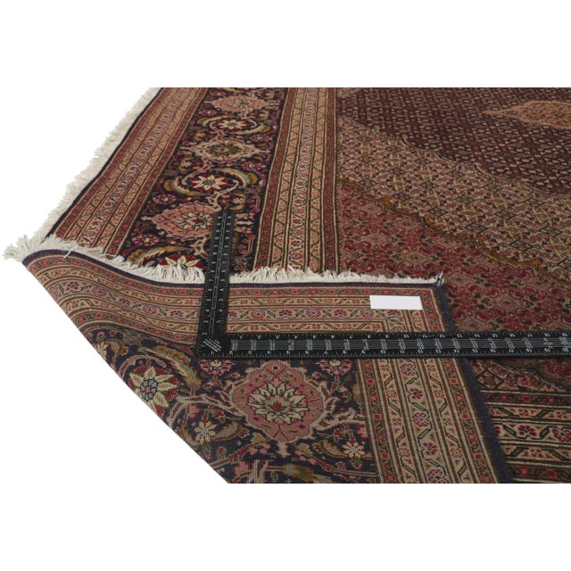 61005 Vintage Persian Mahi Tabriz Rug, 09'11 x 12'08. With ornate details and well-balanced symmetry, this hand-knotted...