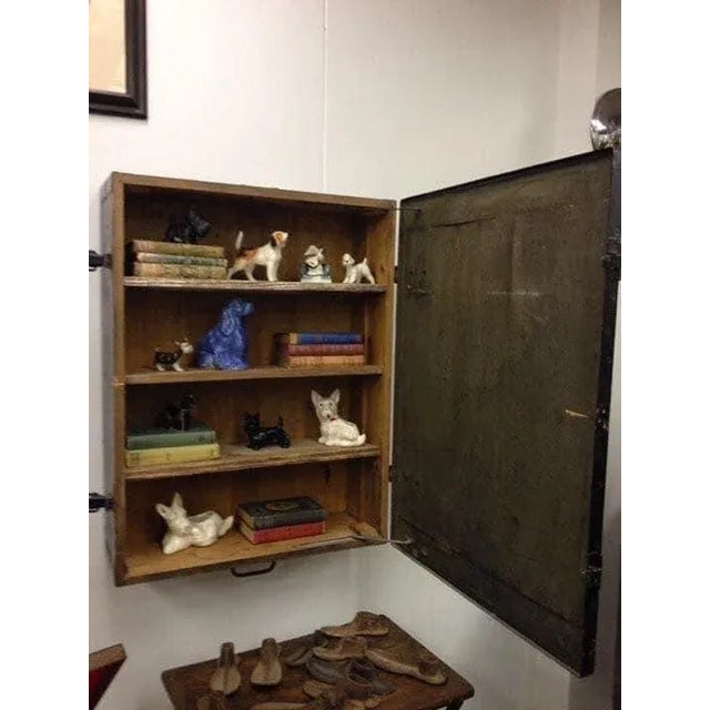 This antique foot locker looks wonderful mounted on a wall. It is made from heavy wood weighing over 50 pounds. When...