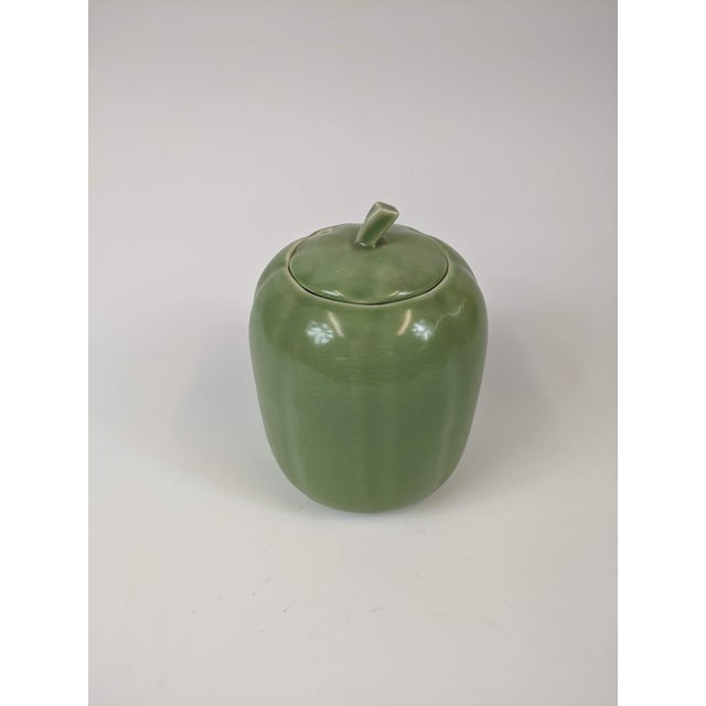 Contemporary melon covered container in Celadon creen
