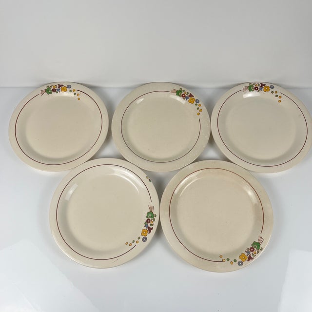 Set of 5 Longwy dessert plates, early 20th century, floral design Glazed earthenware Dimensions: Diameter: 21 cm Height: 2...