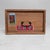 A small Japanese wooden pharmacy cabinet with one drawer, a metal pull handle, and original medicine advertising labels on...
