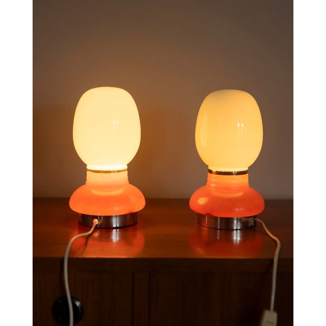 Pair of table lamps with chromed metal base and white and orange glass body, Italian design, 1970s. European Plug (up to...