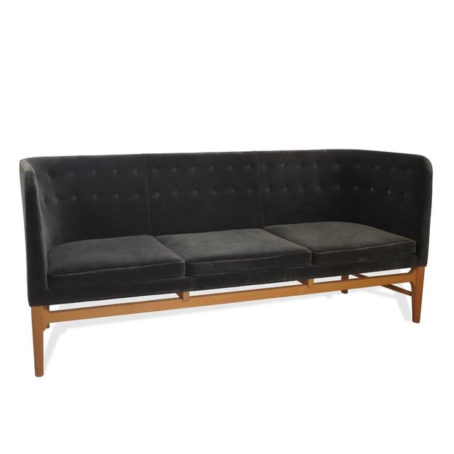 The Mayor AJ5 Sofa, Attributed to Arne Jacobsen and Flemming Lassen, is a celebrated example of early Danish modern...