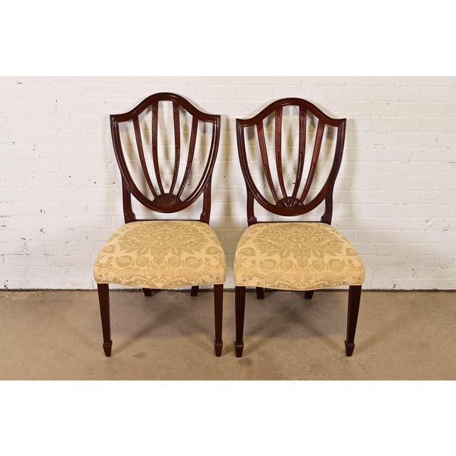 A gorgeous pair of Federal or Hepplewhite style shield back side chairs or dining chairs By Baker Furniture USA, Late 20th...